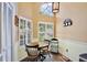 Charming breakfast nook with a round table and chairs near a window at 3992 Radley Ct, Longwood, FL 32779