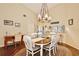 Bright dining room with a large wooden table and white chairs at 3992 Radley Ct, Longwood, FL 32779