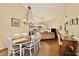 Elegant dining area with a farmhouse table and chairs, near the living room at 3992 Radley Ct, Longwood, FL 32779