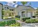 Attractive exterior of a two-story condo with landscaping and a two-car garage at 3992 Radley Ct, Longwood, FL 32779