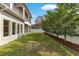 Landscaped backyard with lush greenery and privacy fence at 400 W Hazel St, Orlando, FL 32804