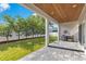 Covered patio, grassy yard, and wooden ceiling at 400 W Hazel St, Orlando, FL 32804