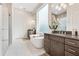 Spa-like bathroom with soaking tub, walk-in shower, and dual vanities at 400 W Hazel St, Orlando, FL 32804