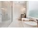 Modern bathroom with a freestanding tub, walk-in shower, and stylish vanity at 400 W Hazel St, Orlando, FL 32804