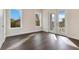 Bright bedroom with hardwood floors and large windows at 400 W Hazel St, Orlando, FL 32804