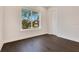 Spacious bedroom with hardwood floors and large window at 400 W Hazel St, Orlando, FL 32804