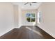 Bright bedroom with hardwood floors, ceiling fan and large windows at 400 W Hazel St, Orlando, FL 32804