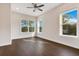 Bright bedroom with hardwood floors, ceiling fan and large windows at 400 W Hazel St, Orlando, FL 32804