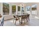 Sun-drenched dining room with hardwood floors and a stunning chandelier at 400 W Hazel St, Orlando, FL 32804