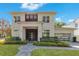 Two-story modern home with gray exterior, dark wood accents, and landscaped lawn at 400 W Hazel St, Orlando, FL 32804