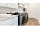 Bright laundry room with washer, dryer, and cabinets at 400 W Hazel St, Orlando, FL 32804