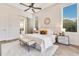 Main bedroom with king bed, ensuite bathroom access, and a sliding barn door at 400 W Hazel St, Orlando, FL 32804