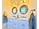 Elegant bathroom with double vanity, marble countertops, and decorative mirrors at 41289 County Road, 452, Leesburg, FL 34788