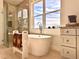 Bathroom with a freestanding tub and walk-in shower at 41289 County Road, 452, Leesburg, FL 34788