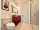 Bathroom with red vanity, walk-in shower, and tile flooring at 41289 County Road, 452, Leesburg, FL 34788