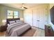 Bedroom with a queen bed and access to a double door closet at 41289 County Road, 452, Leesburg, FL 34788