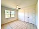 Spacious bedroom with tile flooring and a double door closet at 41289 County Road, 452, Leesburg, FL 34788