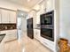 Kitchen with stainless steel appliances and white cabinets at 41289 County Road, 452, Leesburg, FL 34788