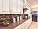 Modern kitchen boasting granite countertops and white cabinets at 41289 County Road, 452, Leesburg, FL 34788