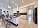 Modern kitchen with granite countertops, white cabinets, and a large island at 41289 County Road, 452, Leesburg, FL 34788