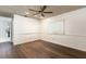 Bright bedroom featuring wood floors and a ceiling fan at 425 Iowa Woods E Cir, Orlando, FL 32824