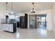 Modern kitchen with marble accents and stainless steel fridge at 425 Iowa Woods E Cir, Orlando, FL 32824