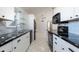 Bright kitchen with white cabinets and marble countertops at 425 Iowa Woods E Cir, Orlando, FL 32824