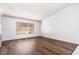 Bright living room with large window and vinyl flooring at 425 Iowa Woods E Cir, Orlando, FL 32824