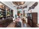 Home office with built-in shelving and hardwood floors at 4326 Isabella Cir, Windermere, FL 34786