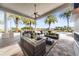 Covered patio with seating area overlooking the pool at 4326 Isabella Cir, Windermere, FL 34786