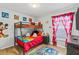 ' bedroom with bunk beds and playful Mickey Mouse theme at 4705 Pershoie Ln, Kissimmee, FL 34746