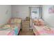 Twin bedroom with colorful bedding and a playful atmosphere at 4705 Pershoie Ln, Kissimmee, FL 34746