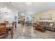 Bright dining room with a chandelier and views to the living room at 4705 Pershoie Ln, Kissimmee, FL 34746