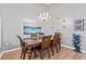 Bright dining room with hardwood floors and a chandelier at 4705 Pershoie Ln, Kissimmee, FL 34746