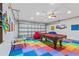 Fun game room with pool table, beanbag chairs, and game area at 4705 Pershoie Ln, Kissimmee, FL 34746