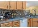 Kitchen detail showing white appliances and a coffee bar at 4705 Pershoie Ln, Kissimmee, FL 34746