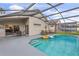 Relaxing pool area with covered patio and lounge chairs at 4705 Pershoie Ln, Kissimmee, FL 34746