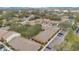 Aerial view showcasing a complex of buildings, parking areas, and surrounding trees at 4944 Tangerine Ave # 4944, Winter Park, FL 32792