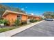 Side view of a condo building showcasing its attractive facade and parking at 4944 Tangerine Ave # 4944, Winter Park, FL 32792