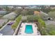 An inviting community pool surrounded by palm trees and lounge chairs at 4944 Tangerine Ave # 4944, Winter Park, FL 32792