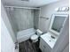 Updated bathroom with gray tile and a vanity at 5325 Curry Ford Rd # 101, Orlando, FL 32812