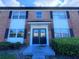 Front entrance of brick building with double doors at 5325 Curry Ford Rd # 101, Orlando, FL 32812