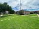 Landscaped lawn area with stepping stones and building in the background at 5325 Curry Ford Rd # 101, Orlando, FL 32812