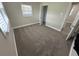 Bedroom with neutral carpeting at 5822 Forest Grove Blvd, Orlando, FL 32808