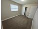 Bright bedroom with neutral walls and carpet at 5822 Forest Grove Blvd, Orlando, FL 32808