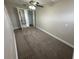 Bedroom with neutral carpeting and ceiling fan at 5822 Forest Grove Blvd, Orlando, FL 32808