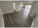 Living room with grey laminate wood flooring at 5822 Forest Grove Blvd, Orlando, FL 32808