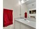 Clean bathroom with a white vanity and a large mirror at 5978 Braemar Pl # 108, Orlando, FL 32822