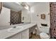 Simple bathroom with a vanity, toilet, and shower at 5978 Braemar Pl # 108, Orlando, FL 32822