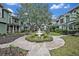 Community courtyard with fountain and landscaping at 5978 Braemar Pl # 108, Orlando, FL 32822